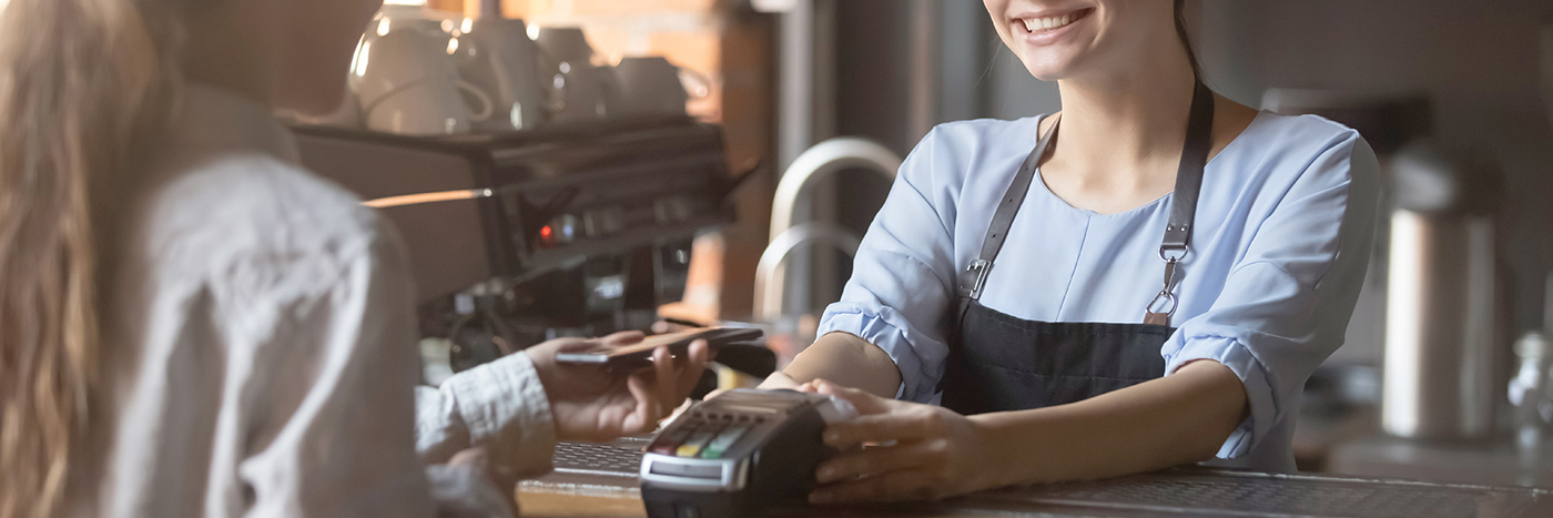 Cashier taking credit card